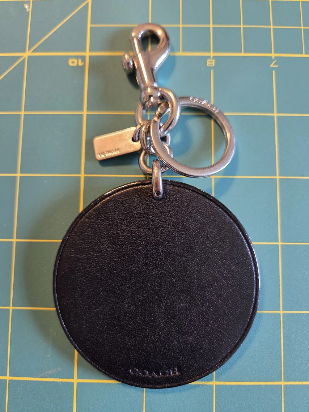 COACH New York Round Leather Keychain - Black with Gold Accents